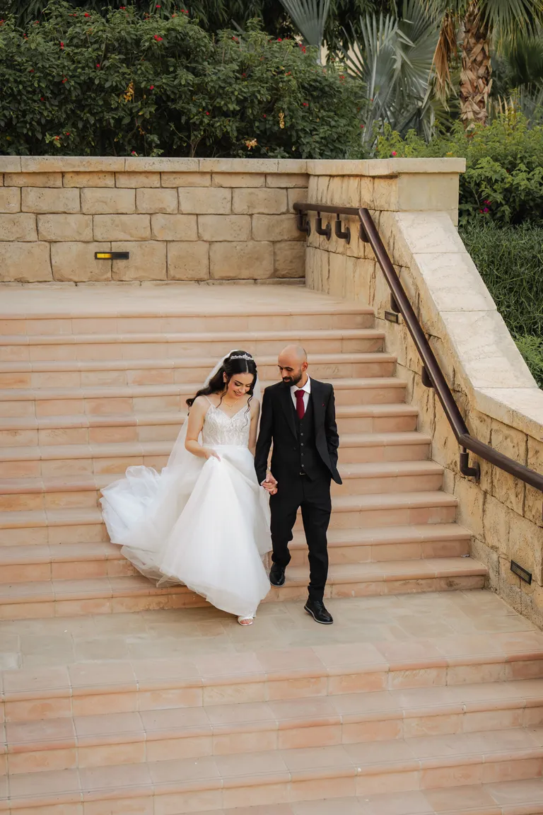Bride and groom smiling at each other
